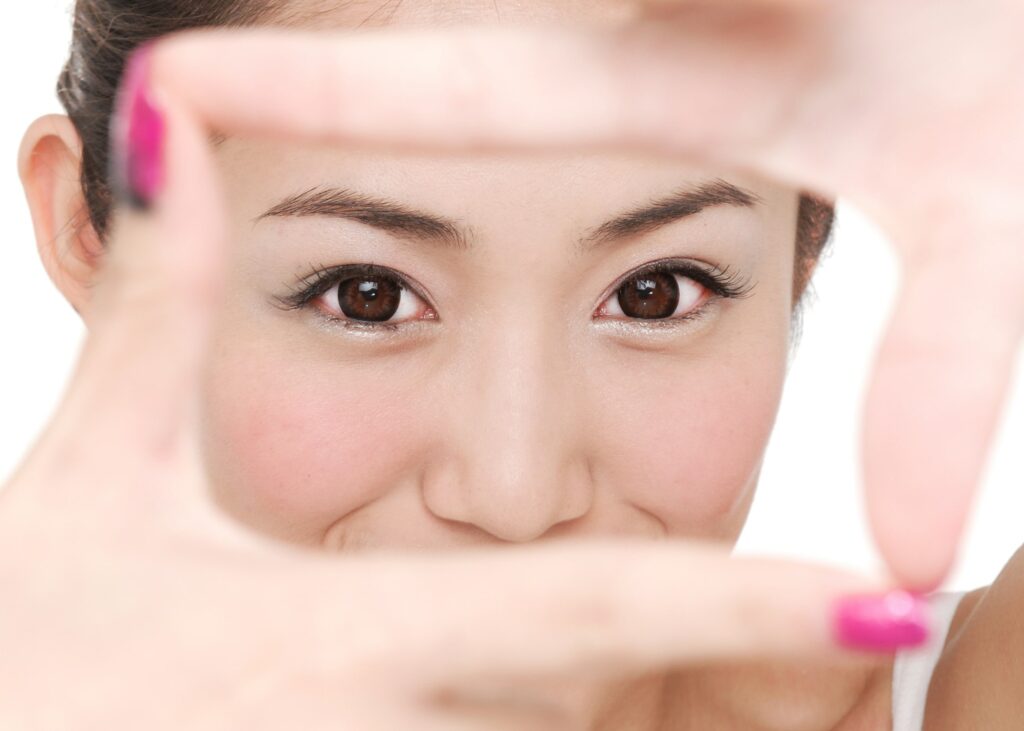 Woman forcing focus on her eyes