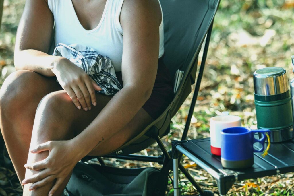 Woman seating and touching her legs affected by lipedema. Lipedema insights are appreciated by other patients.
